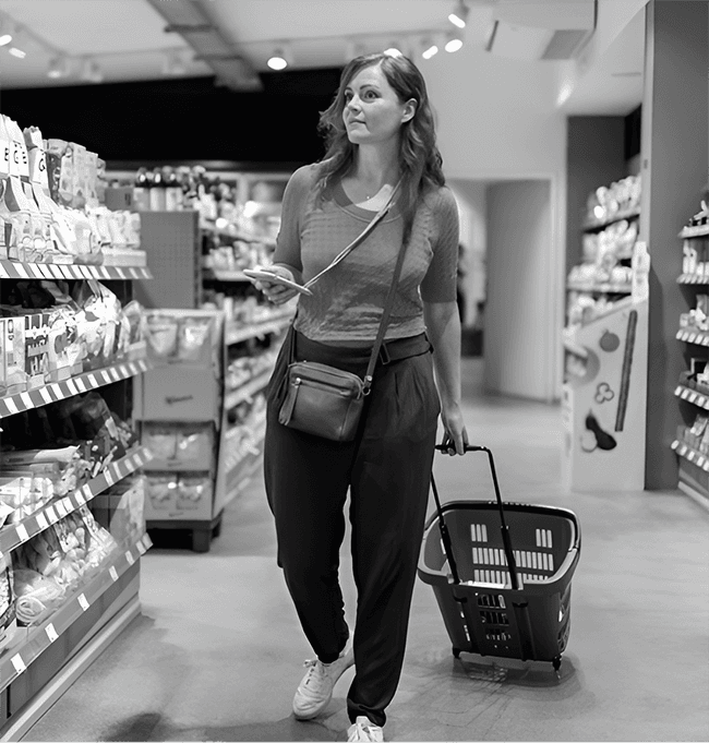 Shopper browsing supermarket shelves